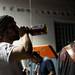 A Kill County member takes a swig of alcohol between songs on Sunday. Daniel Brenner I AnnArbor.com